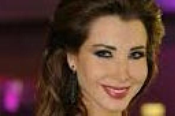 بالصور: نانسي عجرم تتألق بفستان "محتشم" ليلة رأس السنة