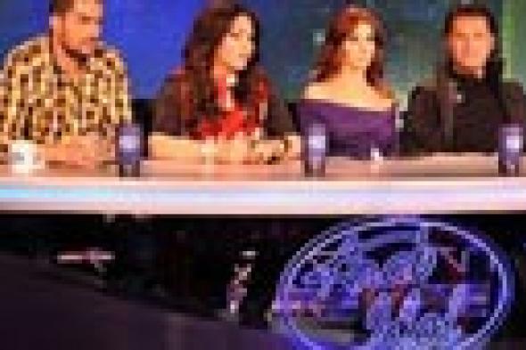 نانسي عجرم تطالب راغب علامة بالاستمرار في Arab Idol