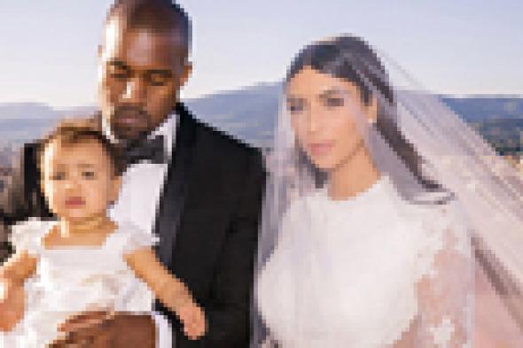 الصور الأولى للطفلة "نورث" في حفل زفاف والديها كيم كاردشيان وكاني ويست