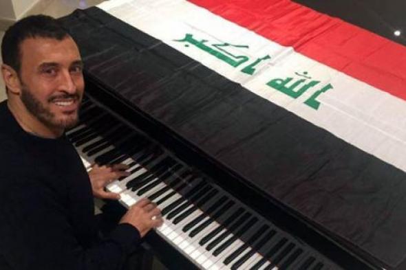 بالصور- كاظم الساهر يقبل علم العراق: وهل للعراق بديل؟