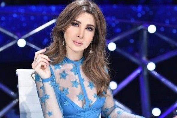 صورة عائلية لنانسي عجرم في أحد الشعنينة.. شاهدوا ابنتيها الجميلتين